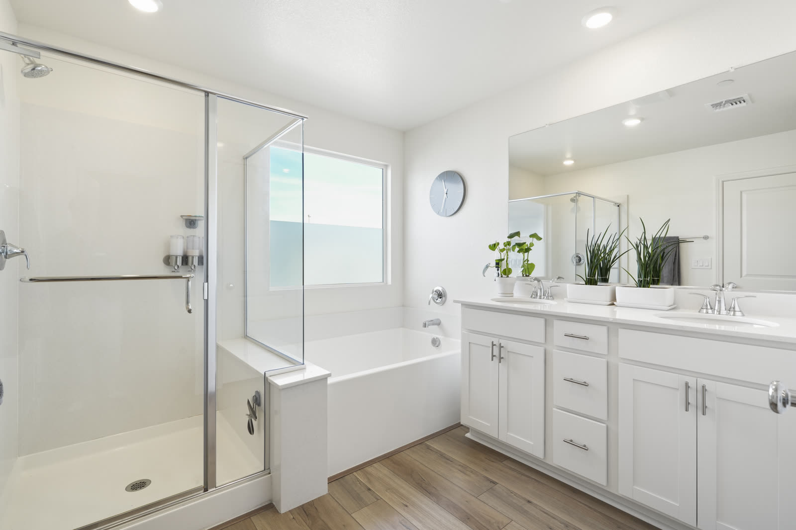 White primary bathroom with soaking tub